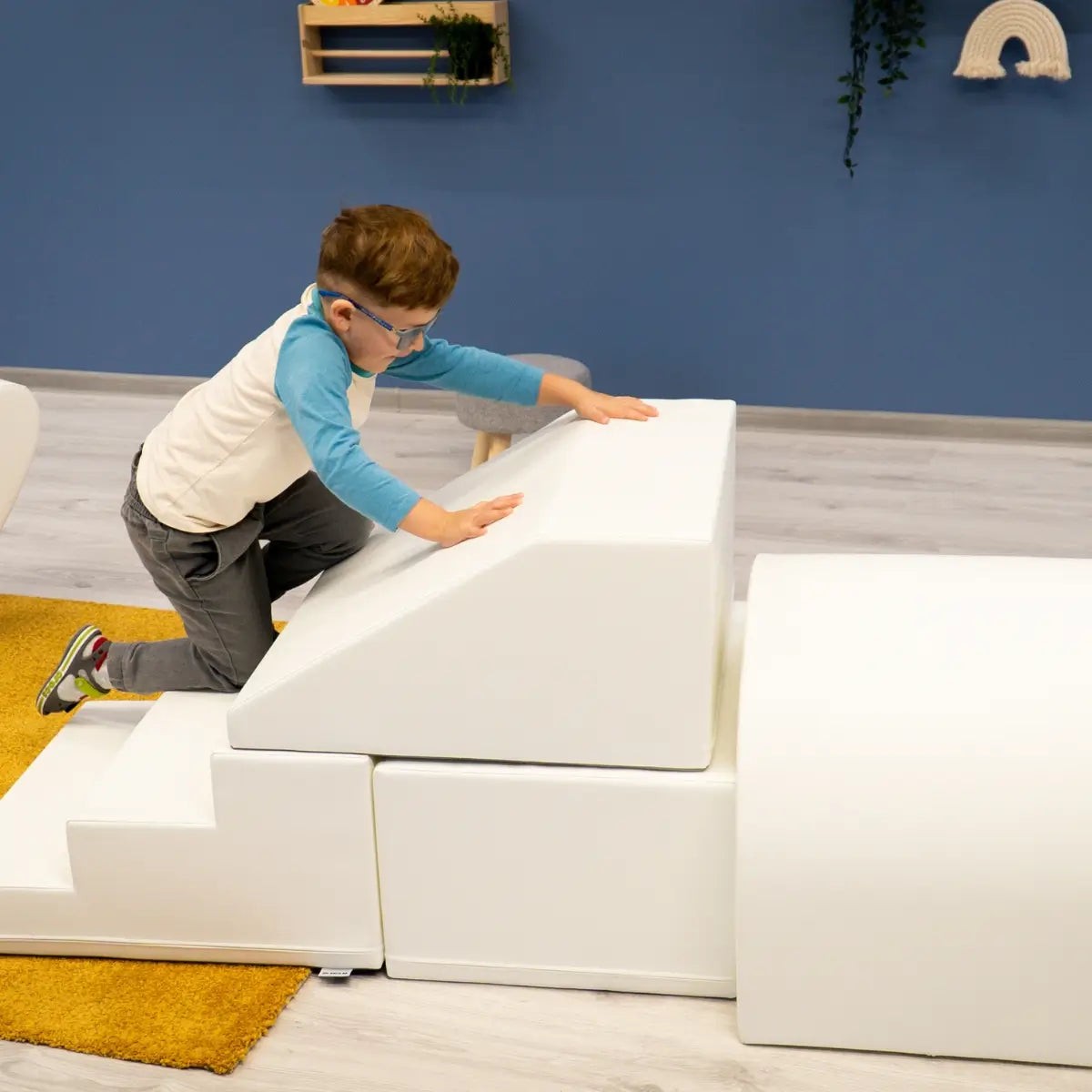 white soft play tunnel for toddlers crawling through with giggles, fostering creativity and motor skills