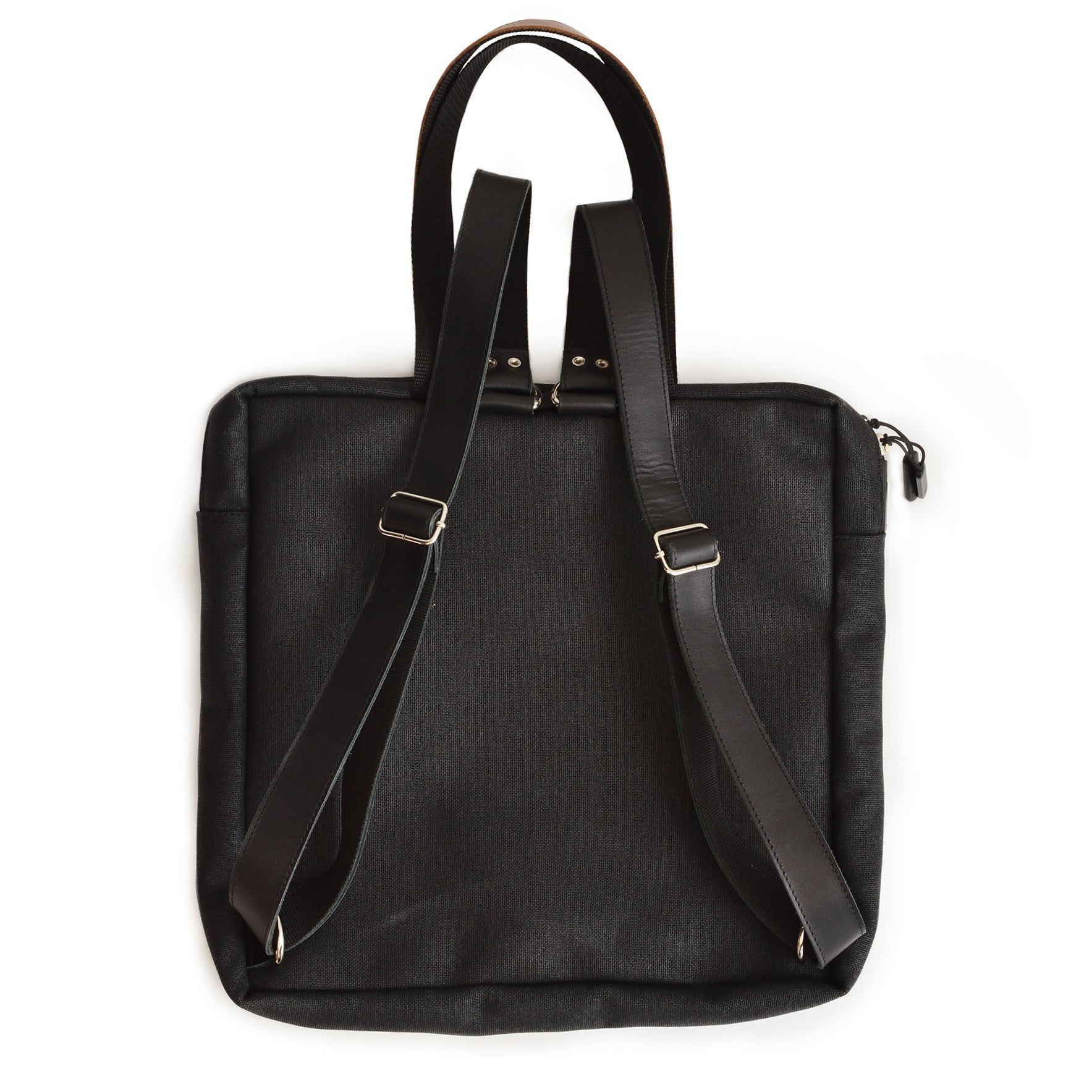 playful beige stockholm backpack with leather details, open front pocket showing anti-theft ykk zip