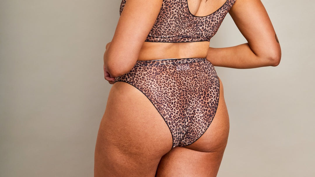 tan-through long sleeve bikini set in natural sunlight, showcasing lightweight fabric and high-waisted coverage for functional sun protection