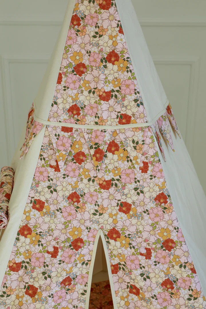 soft floral teepee tent for kids with cotton fabric and pine poles, cozy reading nook in spring garden design