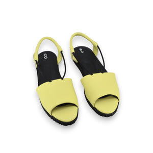 bold lime yellow leather berlin sandals with a confident close-up on the ergonomic insole