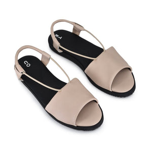 bold close-up of toku berlin sandals showcasing the elegant nude leather and ergonomic insole