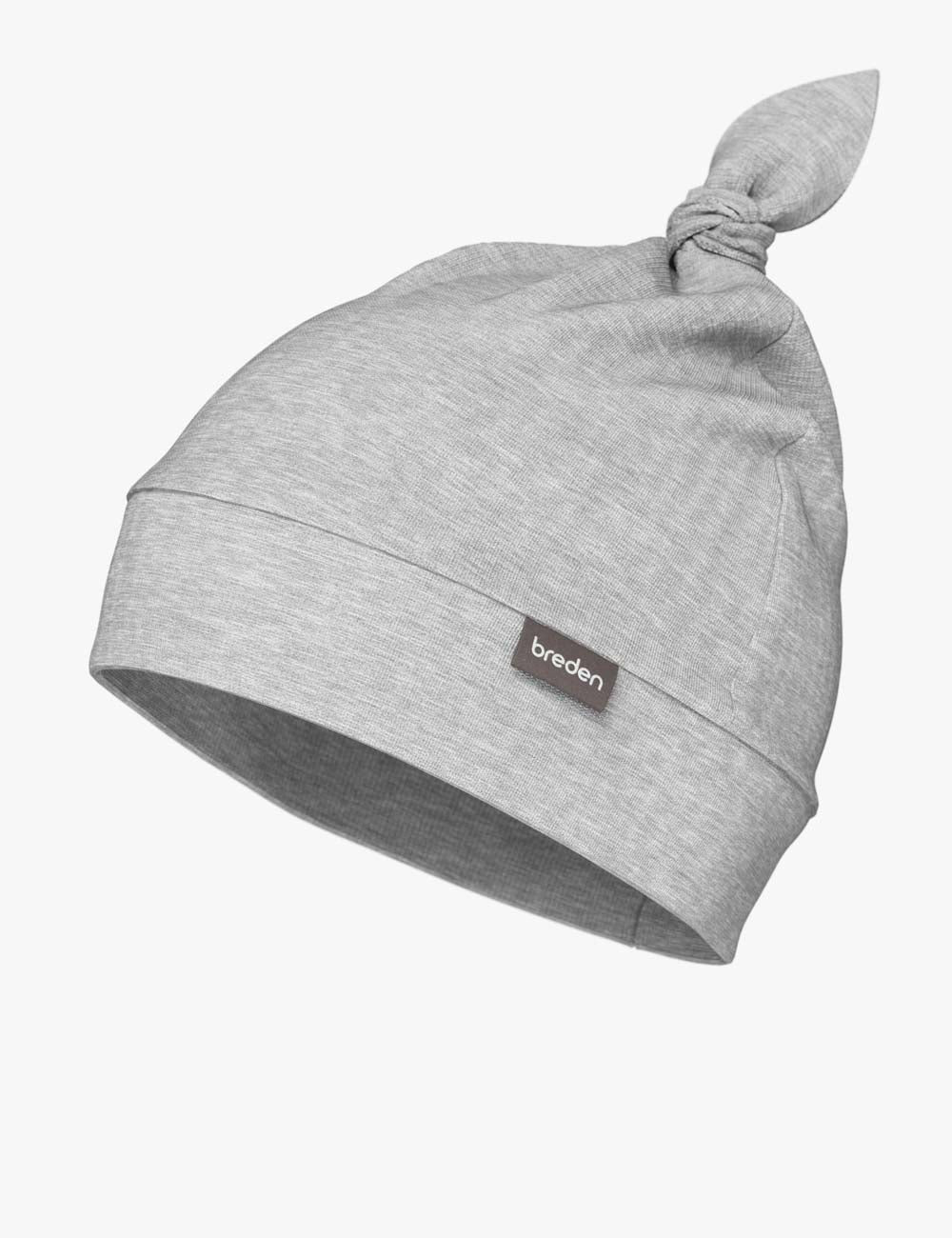 european-crafted bamboo baby hat with an adjustable knot, shown in soft morning light