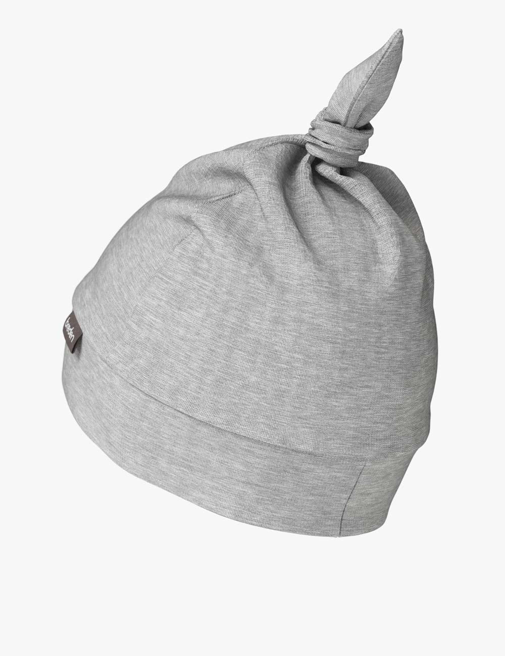 european-crafted bamboo baby hat polly in soft morning light, showing its adjustable knot and breathable fabric