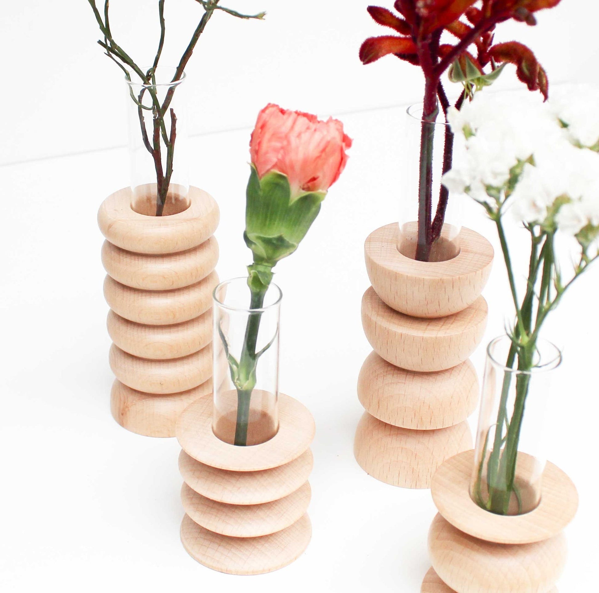 softly lit medium totem wooden vase on a cozy shelf with fresh wildflowers