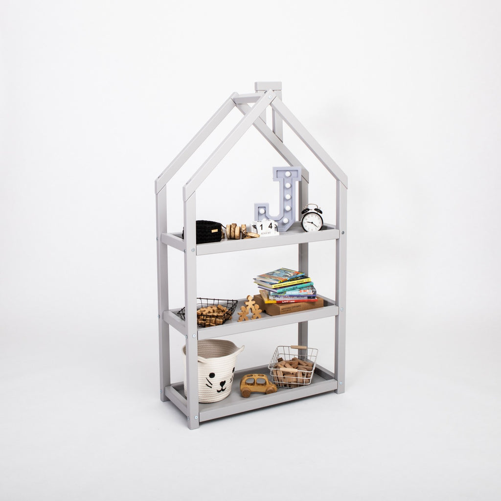 playful grey house-shaped kids shelf with toys displayed in a sunny nursery corner