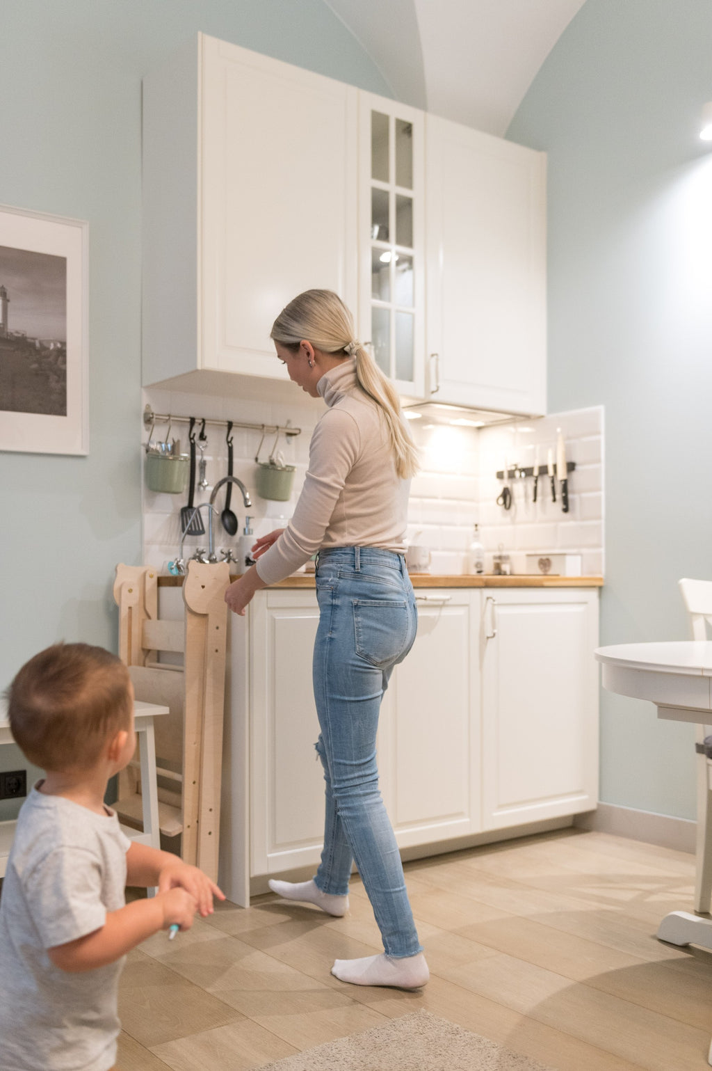a child's golden yellow montessori table and chair set in a bright, sunlit playroom