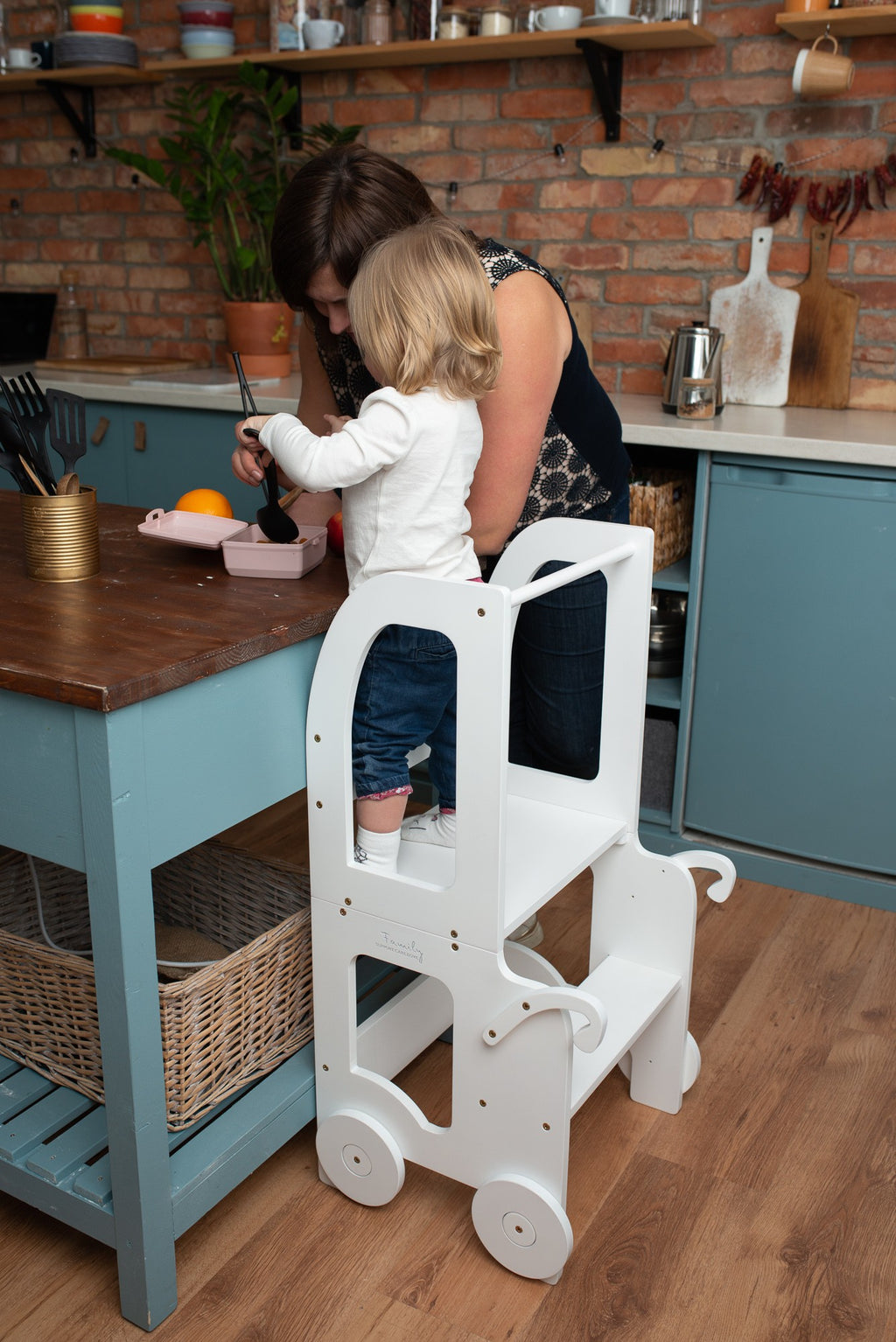 bold yellow montessori kitchen helper table in dramatic morning light