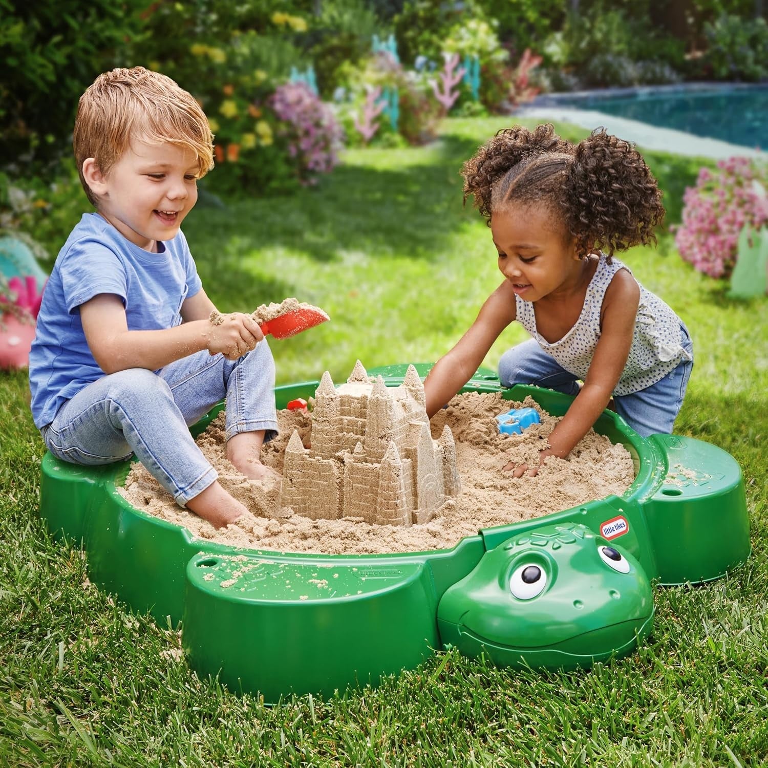 little tikes turtle sandbox with shell lid open, showing smooth interior and built-in seats for kids