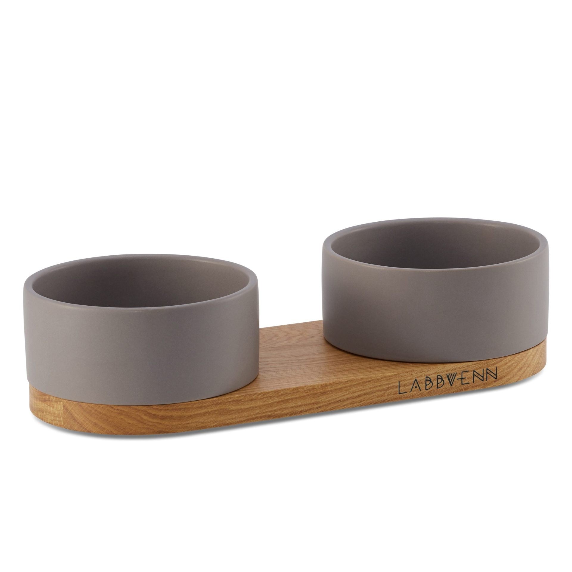 bold cocoa vuku double pet buffet on a dark oak base, dramatic side-lit hero shot