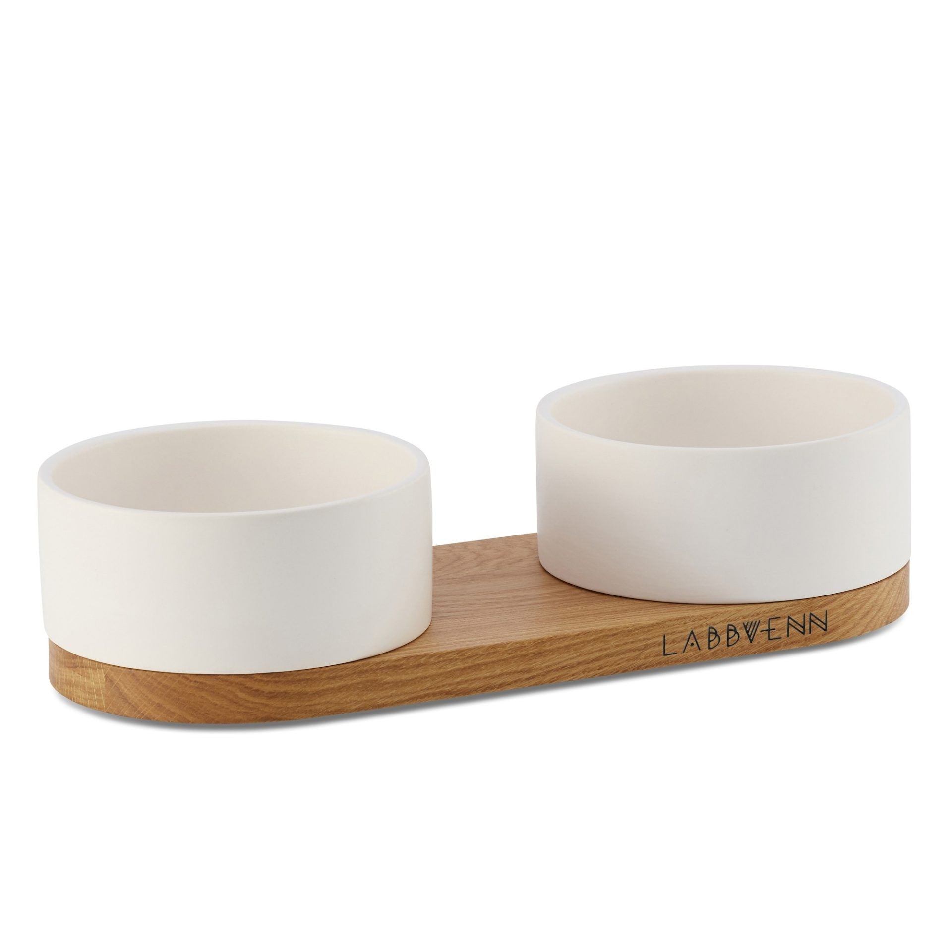 soft morning light on a refined white ceramic pet buffet with a warm oak base