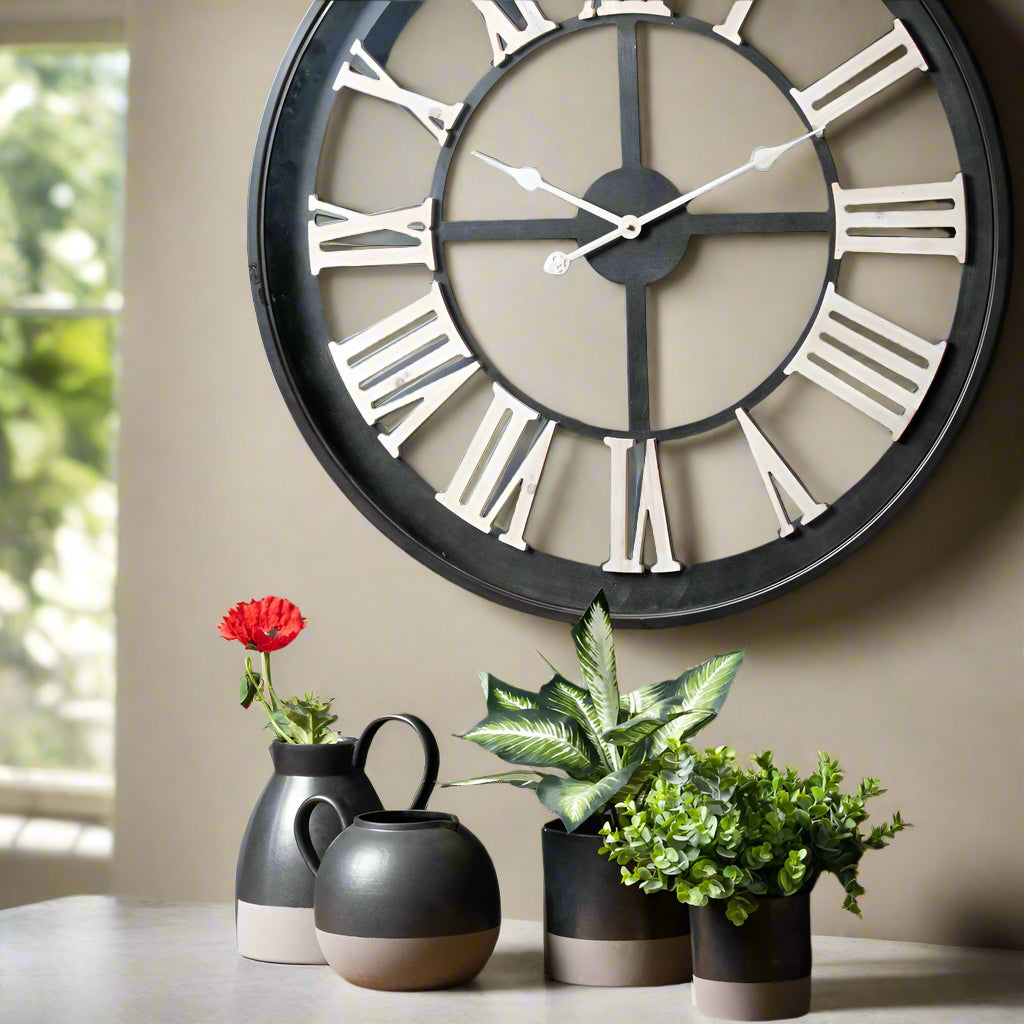 Black Skeleton Clock With White Roman Numerals