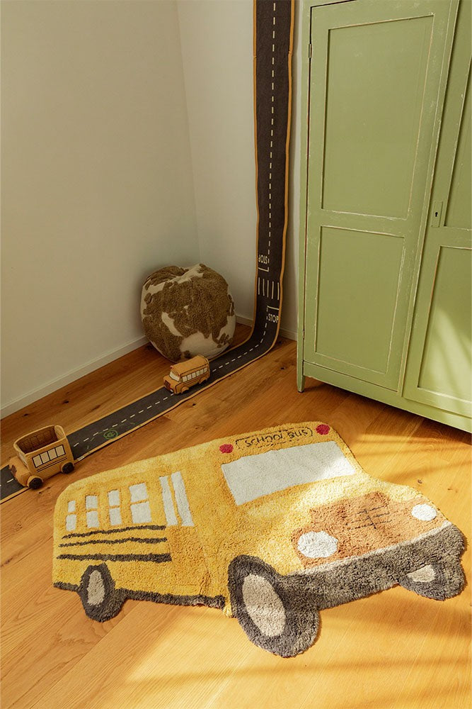 bold kids school bus rug in sunlit room - vibrant yellow cotton play mat for creative adventures