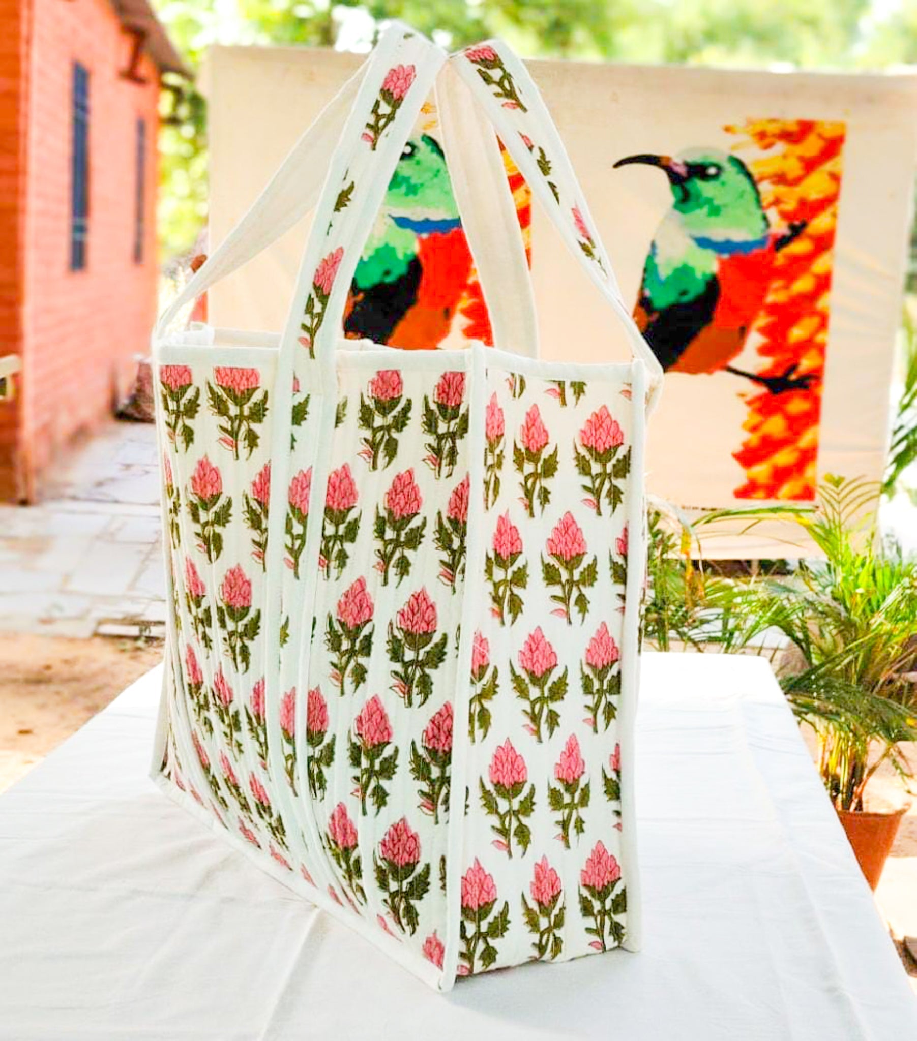 Large quilted weekend tote bag, vibrant pink block print, floral design