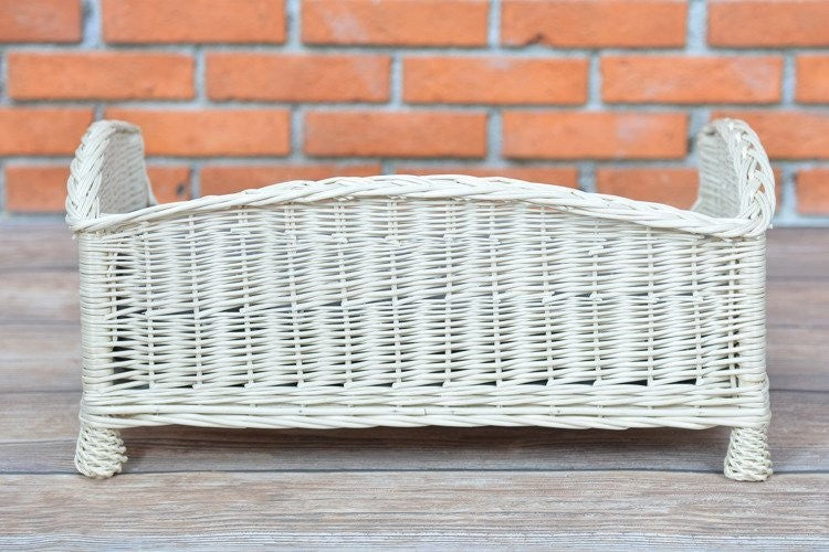 softly lit cozy wicker pet bed with a plush cushion in a sunlit nursery corner