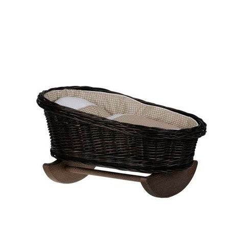 a playful close-up of the wicker rocking cradle's cozy beige checkered bedding