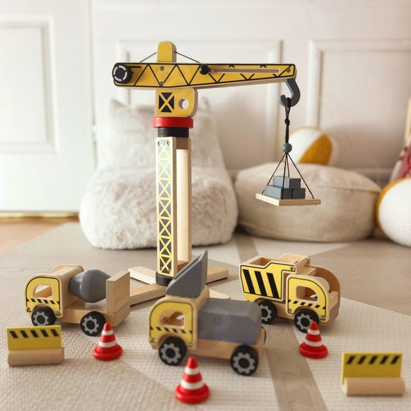a child's hands lifting a wooden block with the woopie green crane