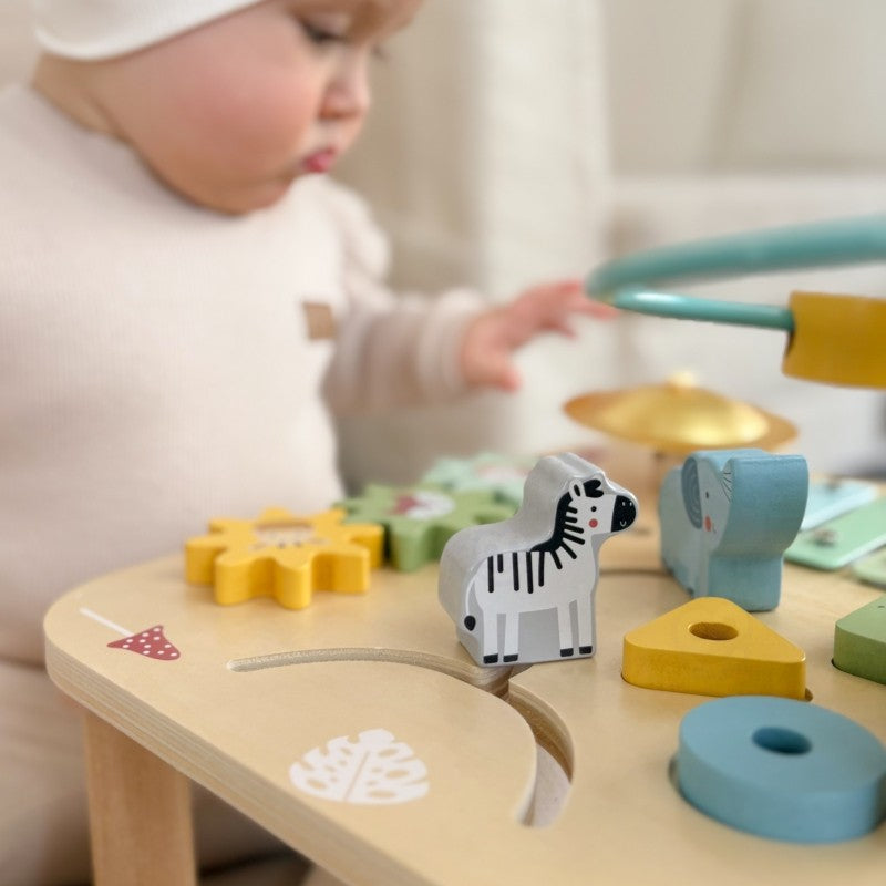 functional woopie green activity table showing all 13 accessories organized for play