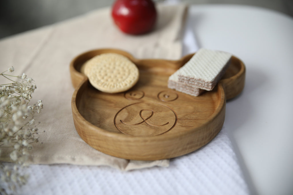 elegant handmade wooden bear plate for kids on a rustic table setting