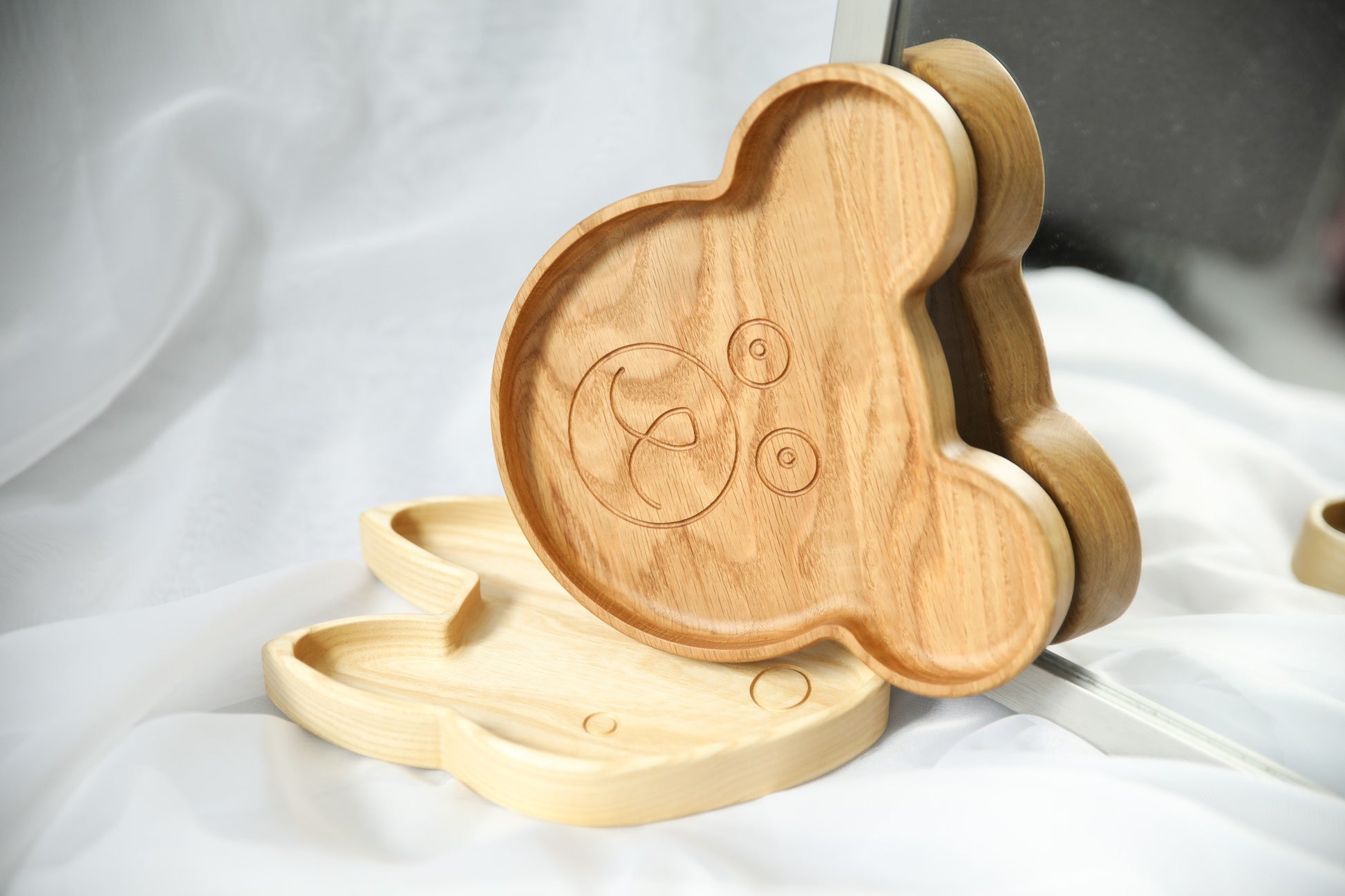 functional wooden bear plate for kids on a simple kitchen countertop