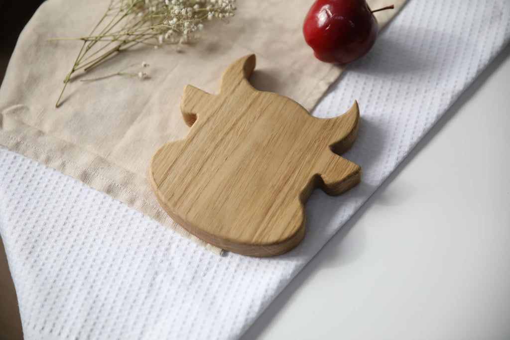 elegant handmade oak wooden plate for kids with bull design, smooth polished surface, natural and safe