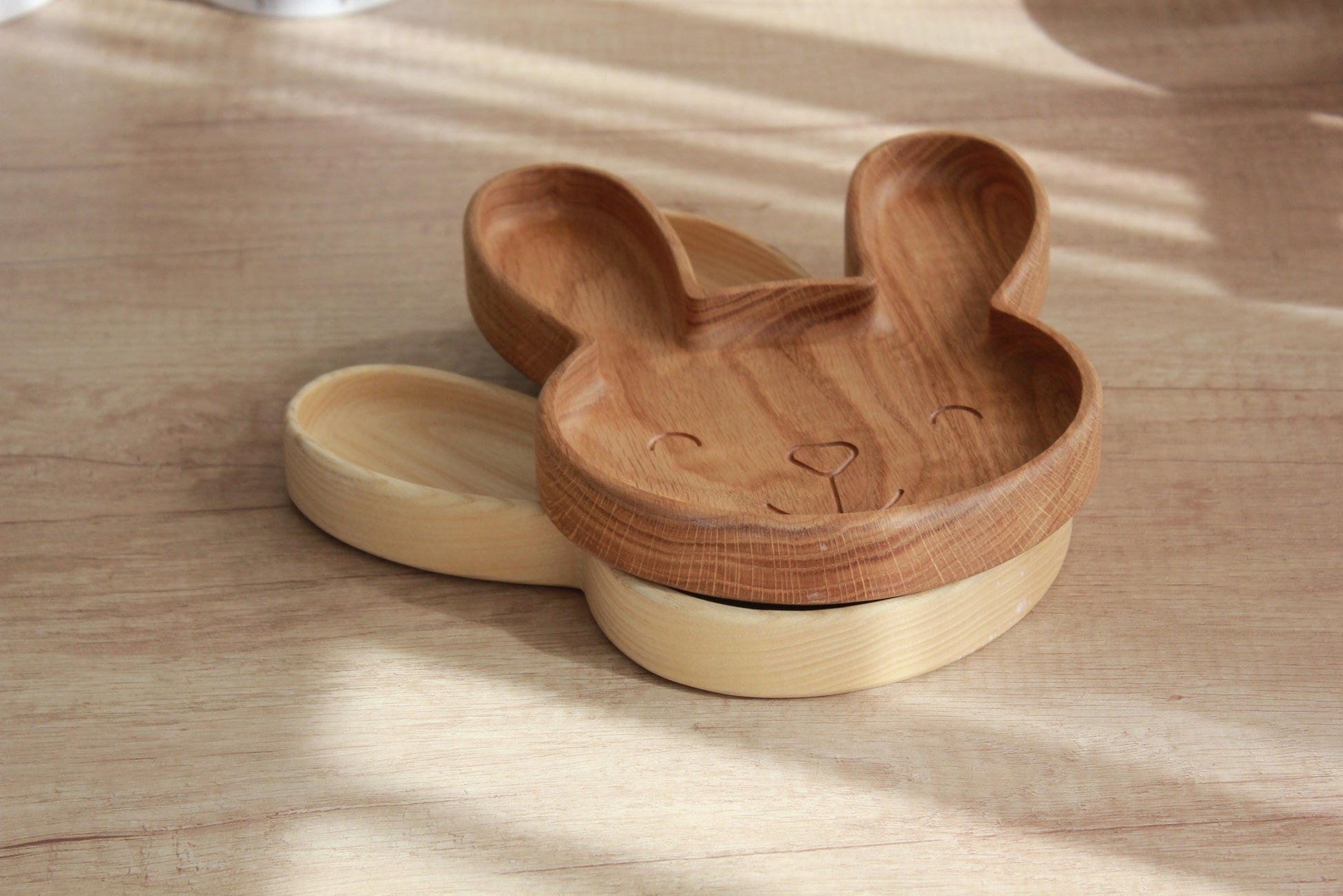 elegant handmade wooden bunny plate for kids, polished oak with soft natural grain, gift-ready on minimalist table