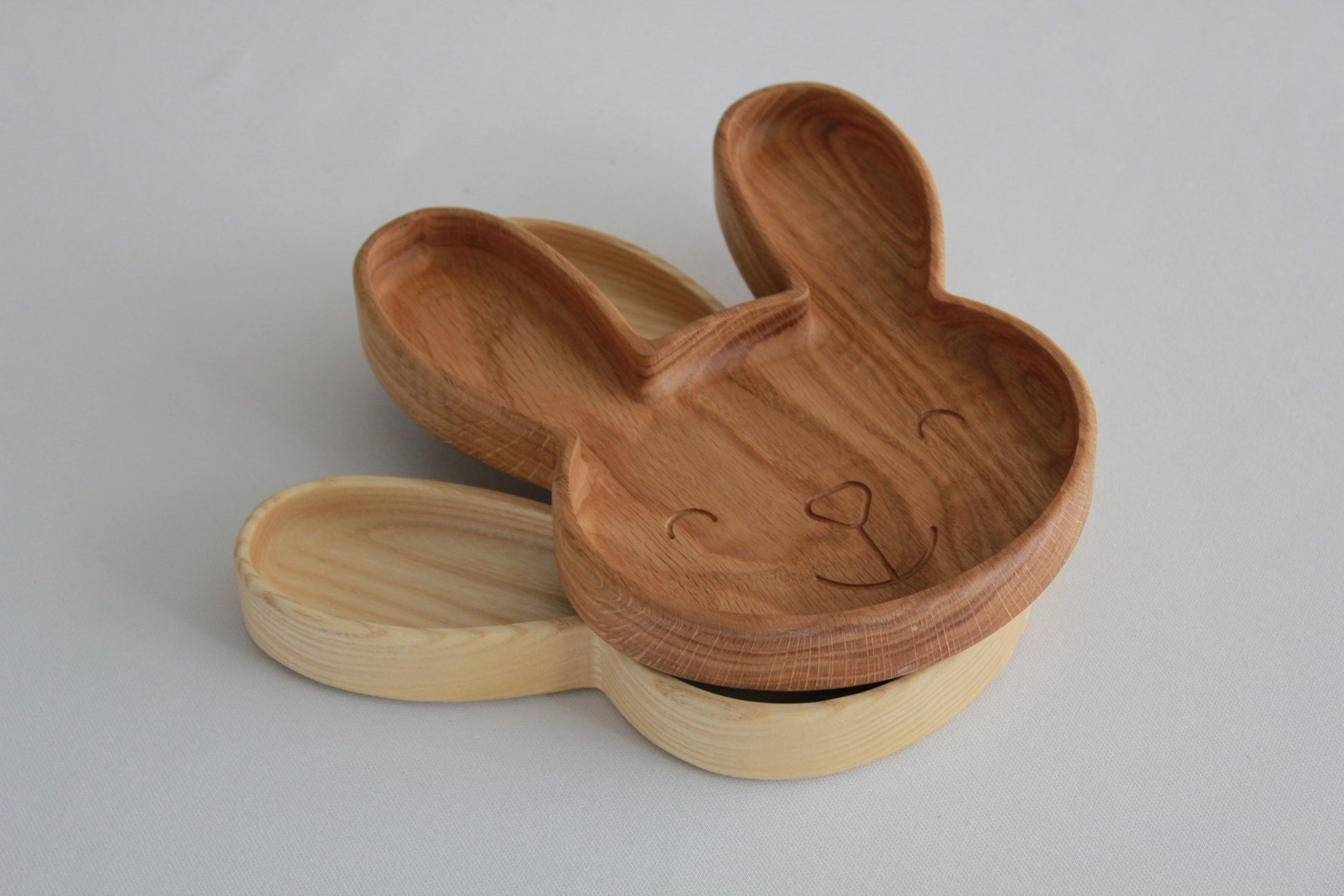 handmade wooden bunny plate for kids on a rustic table, showcasing smooth oak finish and playful design