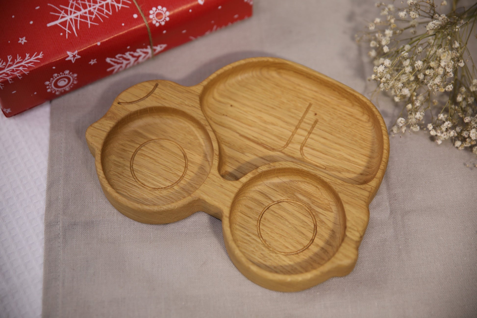 soft-lit handmade wooden kids plate with car design, smooth oak surface, cozy mealtime vibe