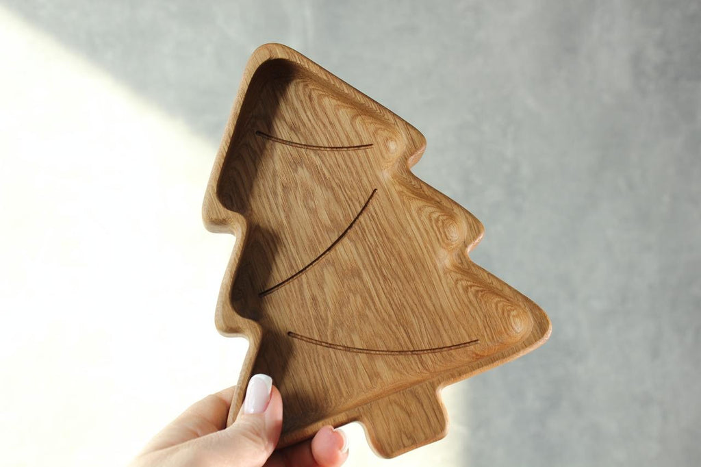 handmade wooden christmas tree plate for kids on a rustic table, natural oak with smooth polished surface