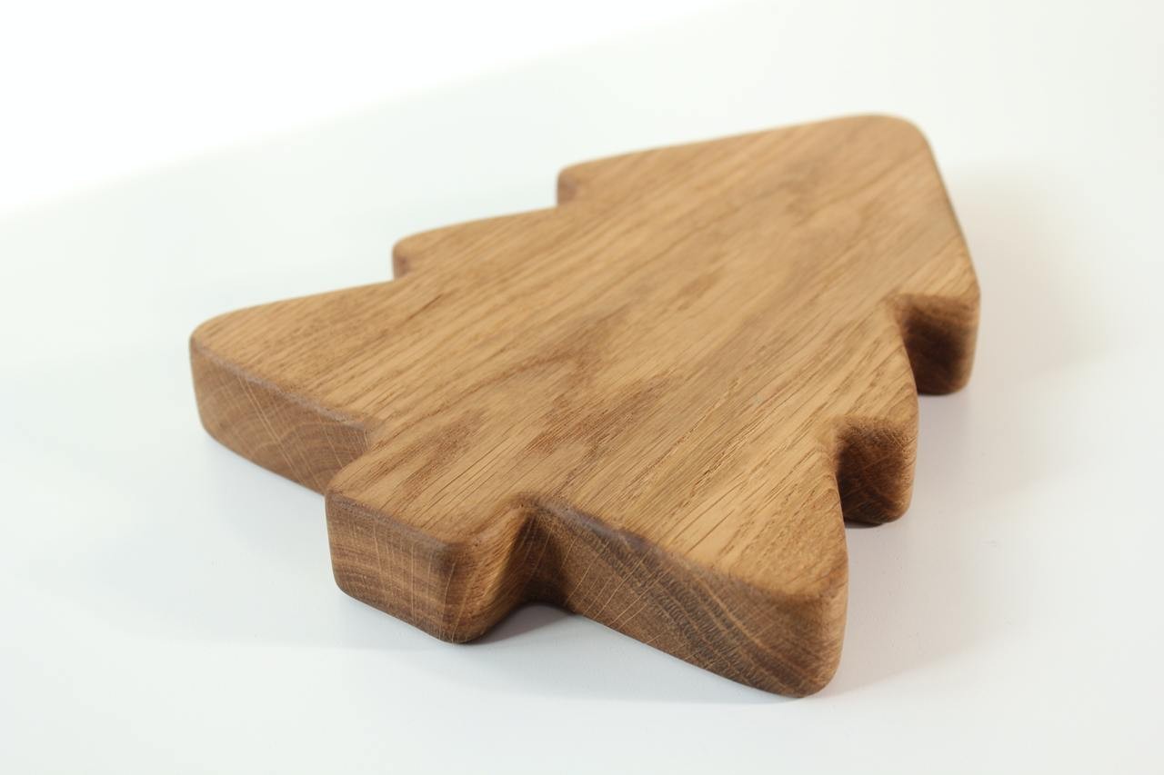 handmade wooden christmas tree plate for kids on a rustic table, showcasing smooth finish and natural wood grain