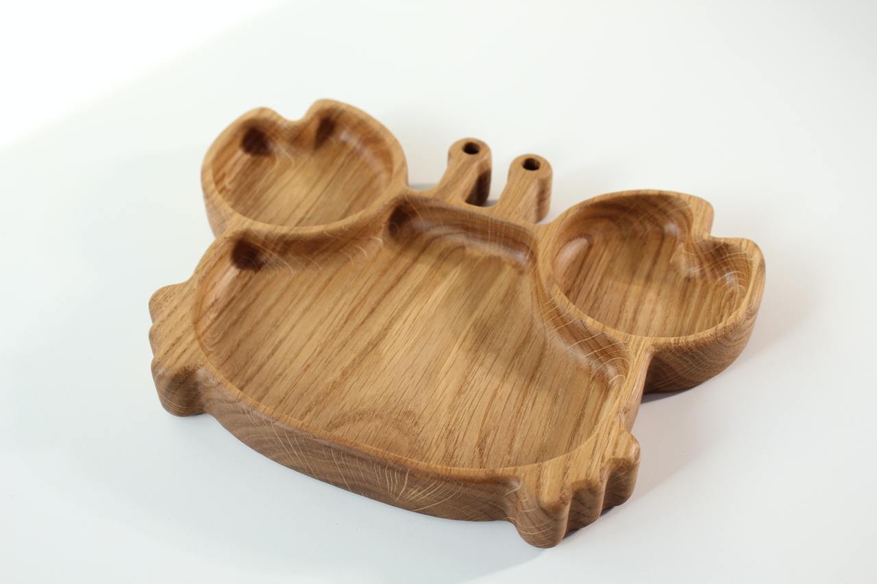 elegant handmade oak kids plate with crab design, smooth polished surface, natural wood grain visible