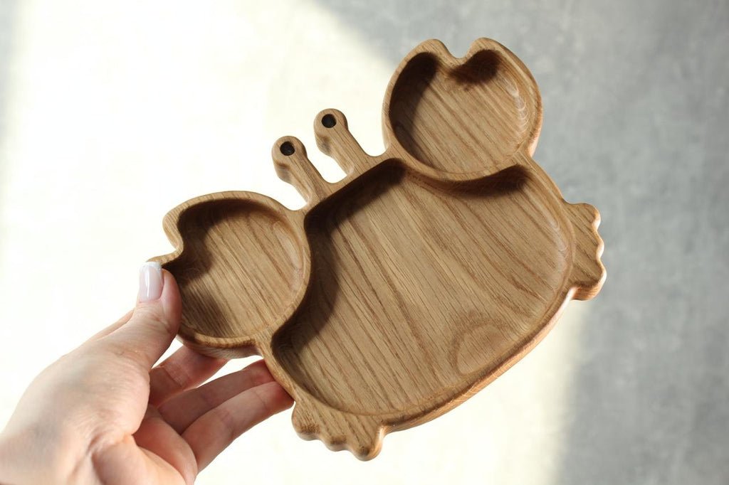 bold handmade oak kids plate with playful crab design, smooth polished surface, eco-friendly and safe for toddlers