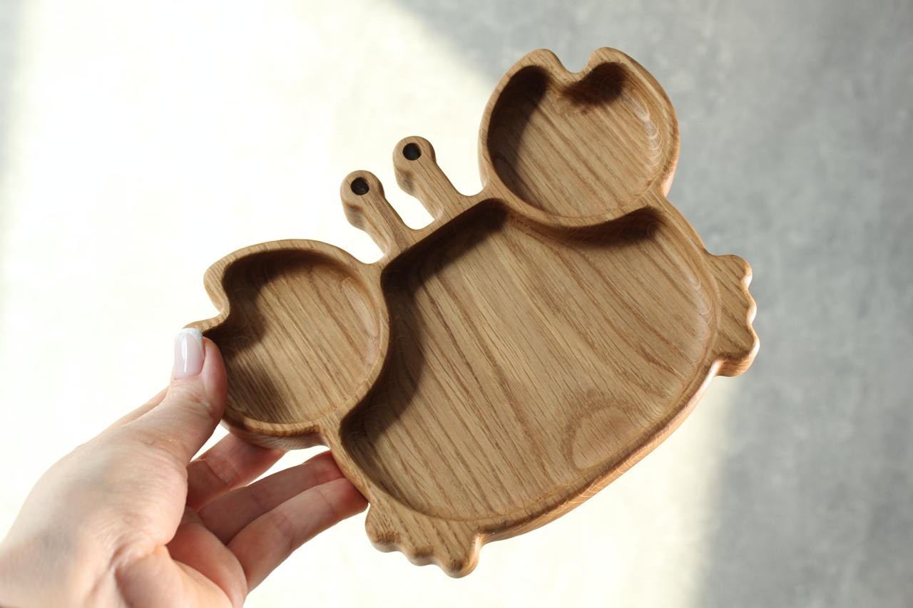 bold handmade oak kids plate with playful crab design, smooth polished surface, eco-friendly and safe for toddlers