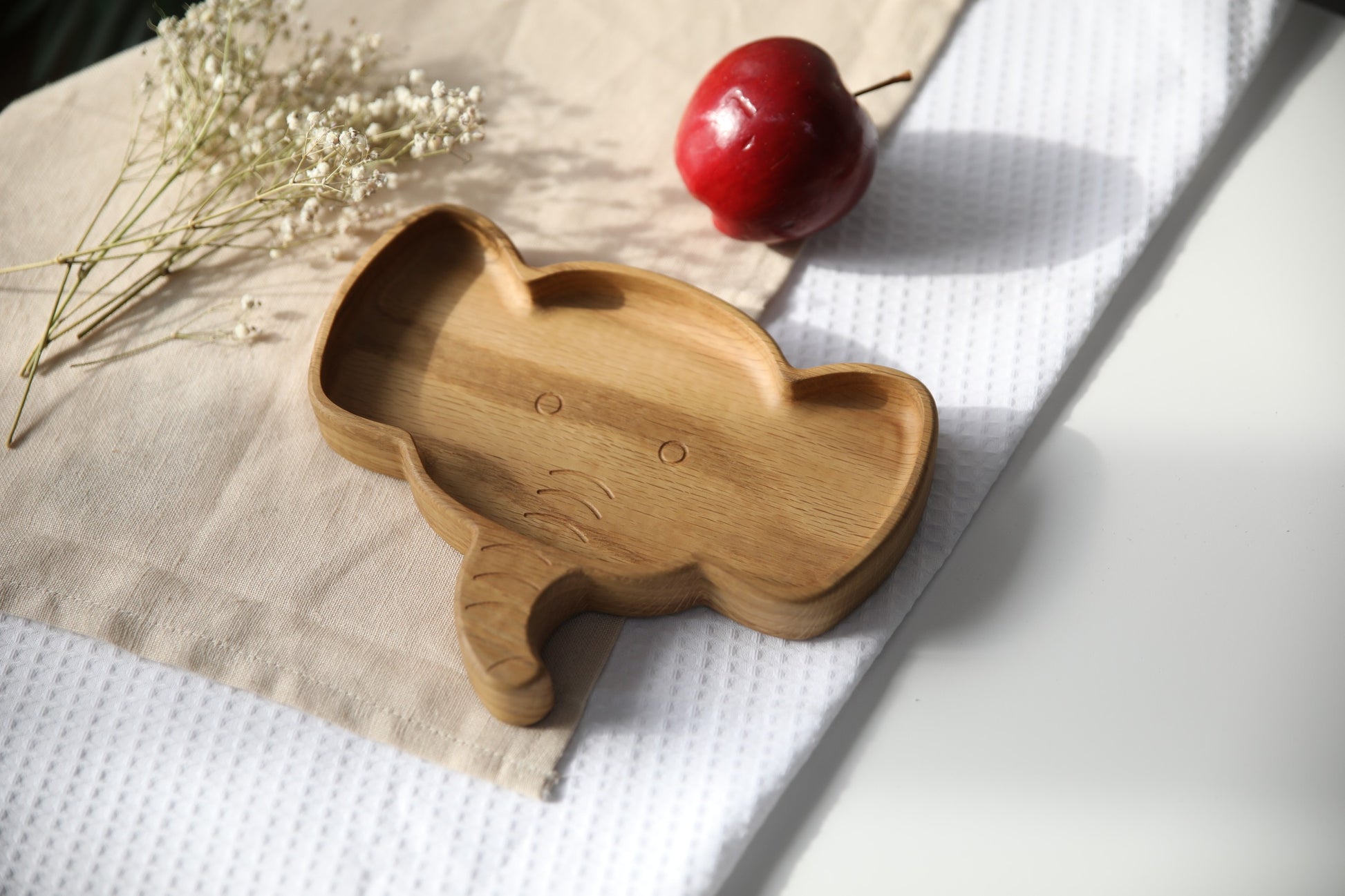 soft-lit handmade wooden elephant plate for kids, smooth oak surface with warm natural tones, safe and stylish
