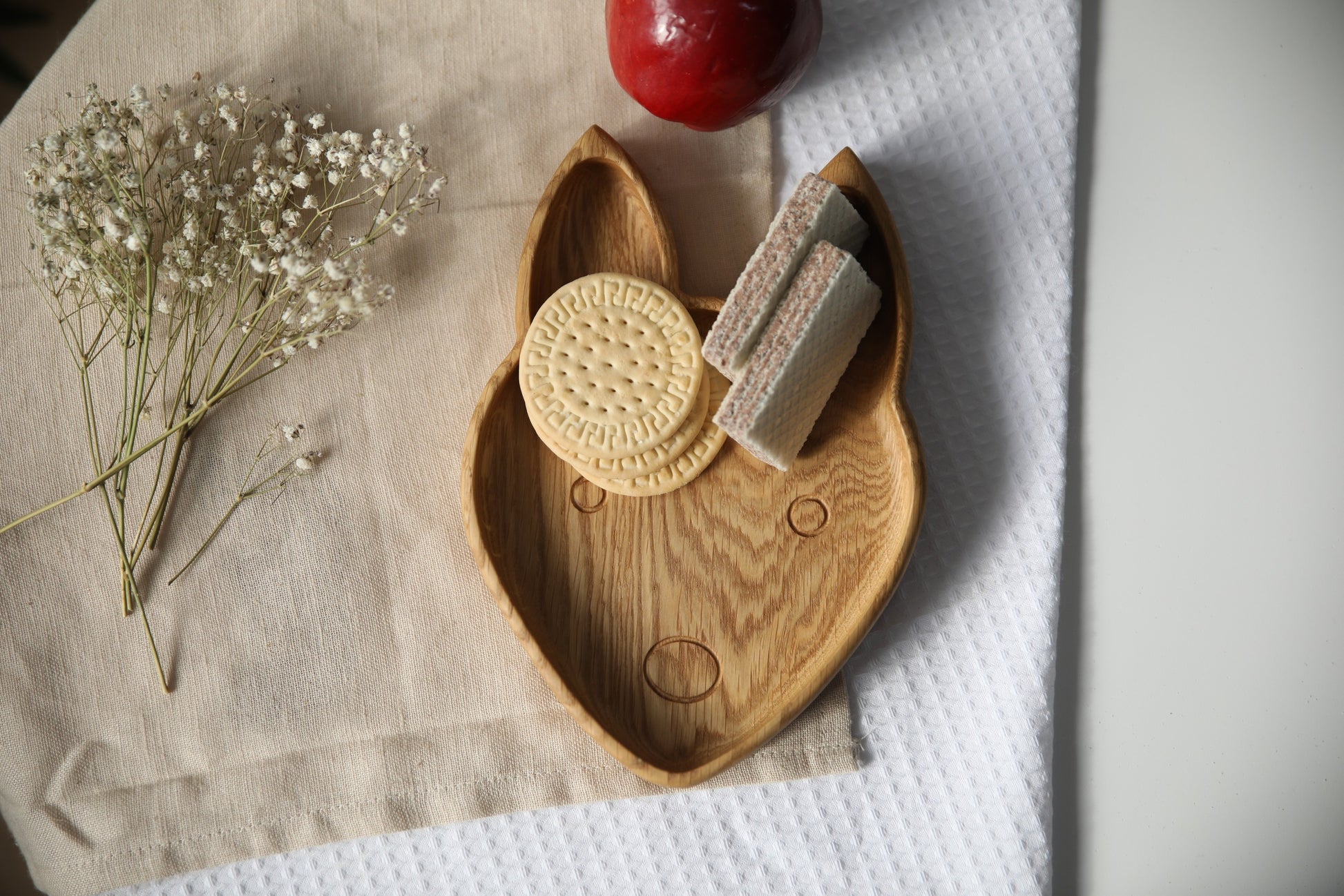 handmade wooden fox plate for kids on a rustic table, showcasing its smooth finish and natural wood grain