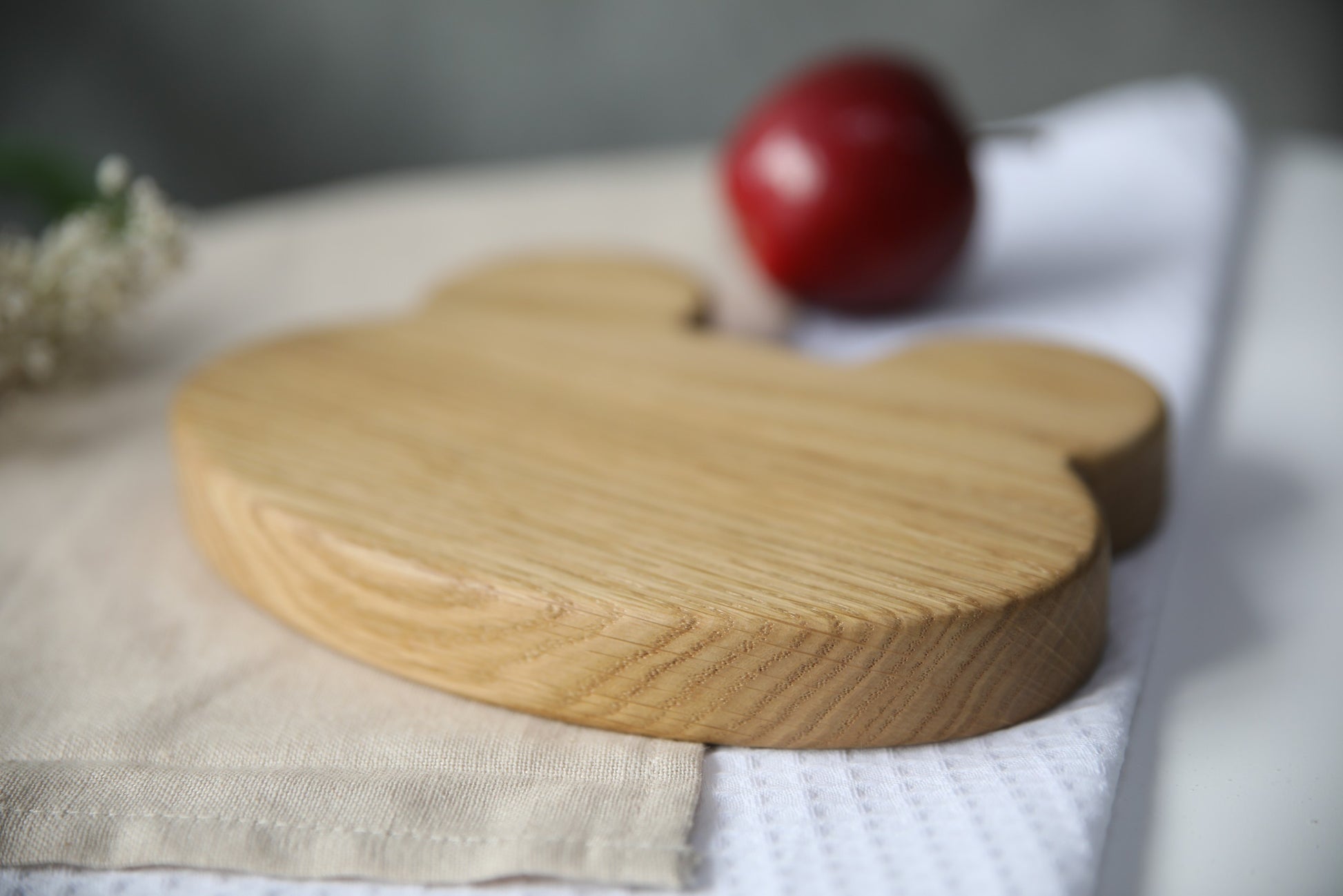 hand-polished frog-shaped wooden plate for kids on a rustic table, showcasing natural grain and eco-friendly charm