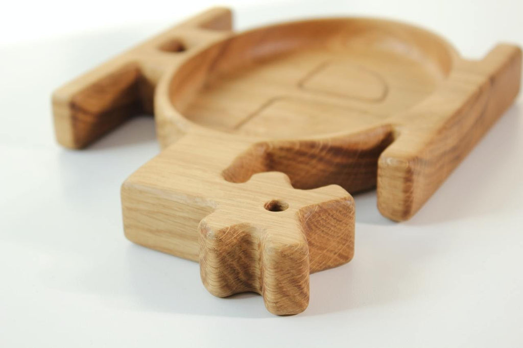 handmade wooden helicopter plate for kids on a rustic table, showcasing smooth oak finish and playful design