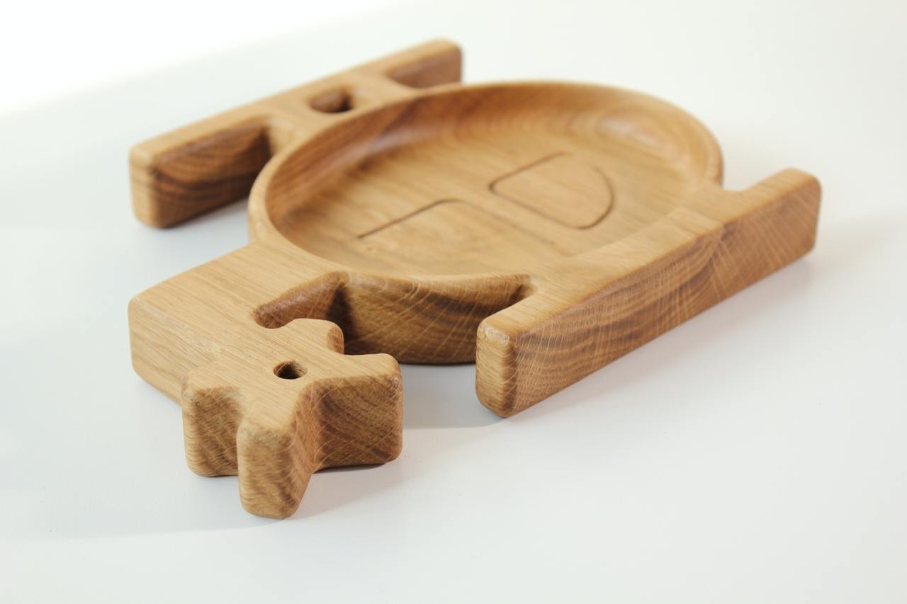 handmade wooden helicopter plate for kids on a rustic table, showcasing smooth oak finish and playful design