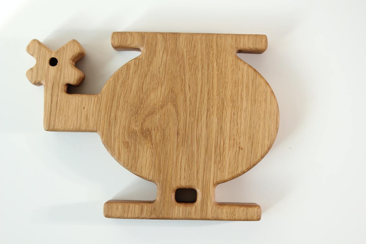 handmade wooden helicopter plate for kids on a rustic table, natural oak with smooth polished finish