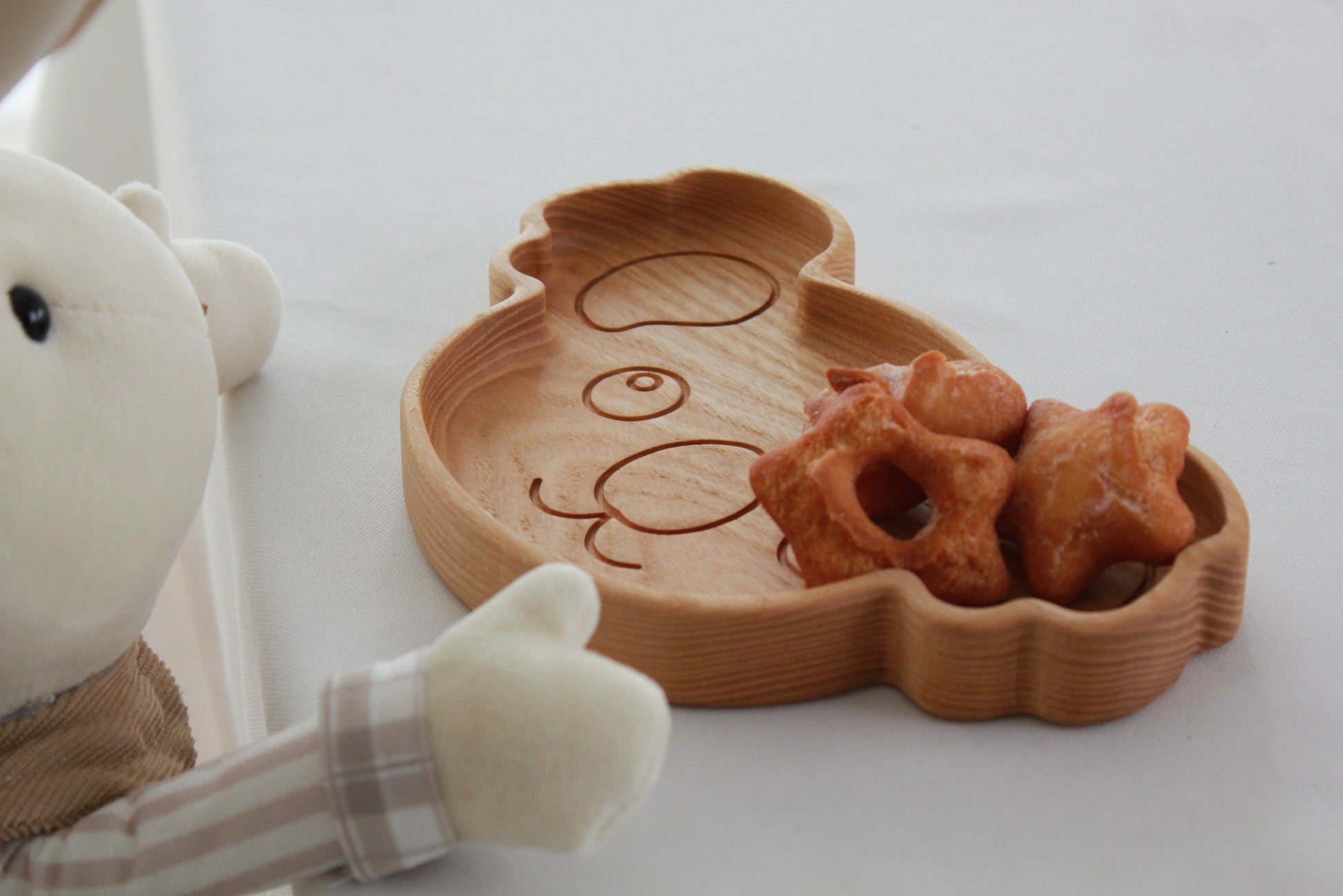adorable koala wooden plate for kids on a sunlit table, showcasing smooth hand-polished oak and playful engraving options