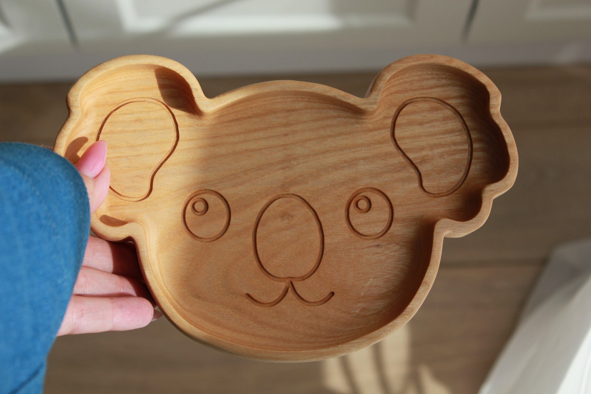 elegant handmade wooden koala plate for kids, smooth oak surface with natural grain, gift-ready on minimalist table