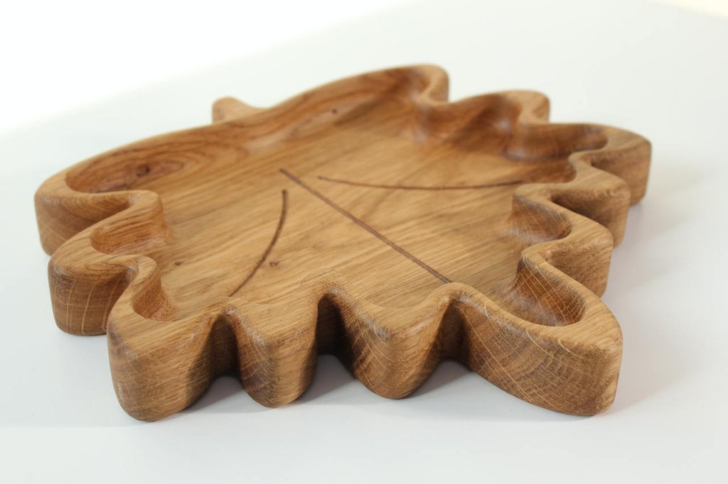 soft maple leaf wooden plate for kids on a cozy kitchen table, natural oak with smooth hand-polished finish