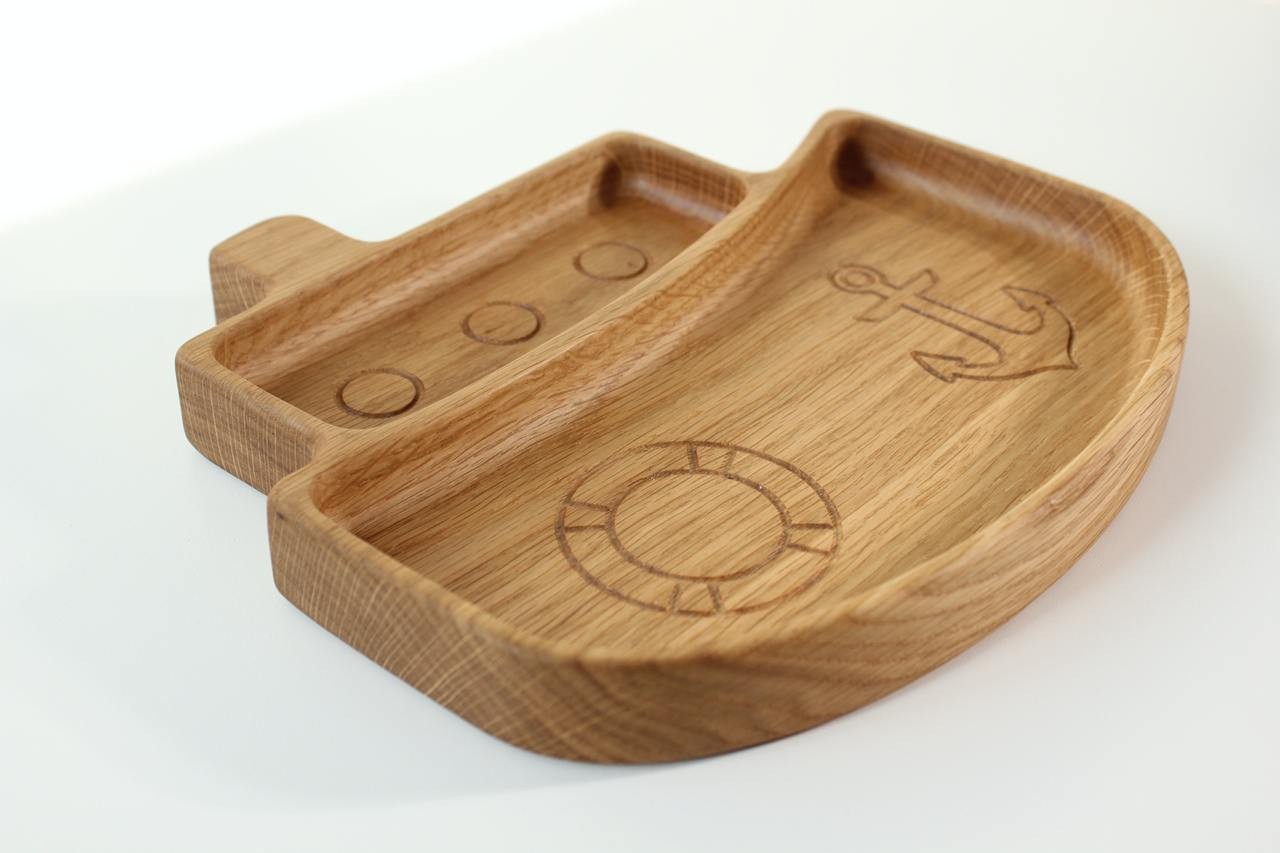 soft-lit handmade wooden kids plate with ship design, smooth oak surface, safe for baby meals