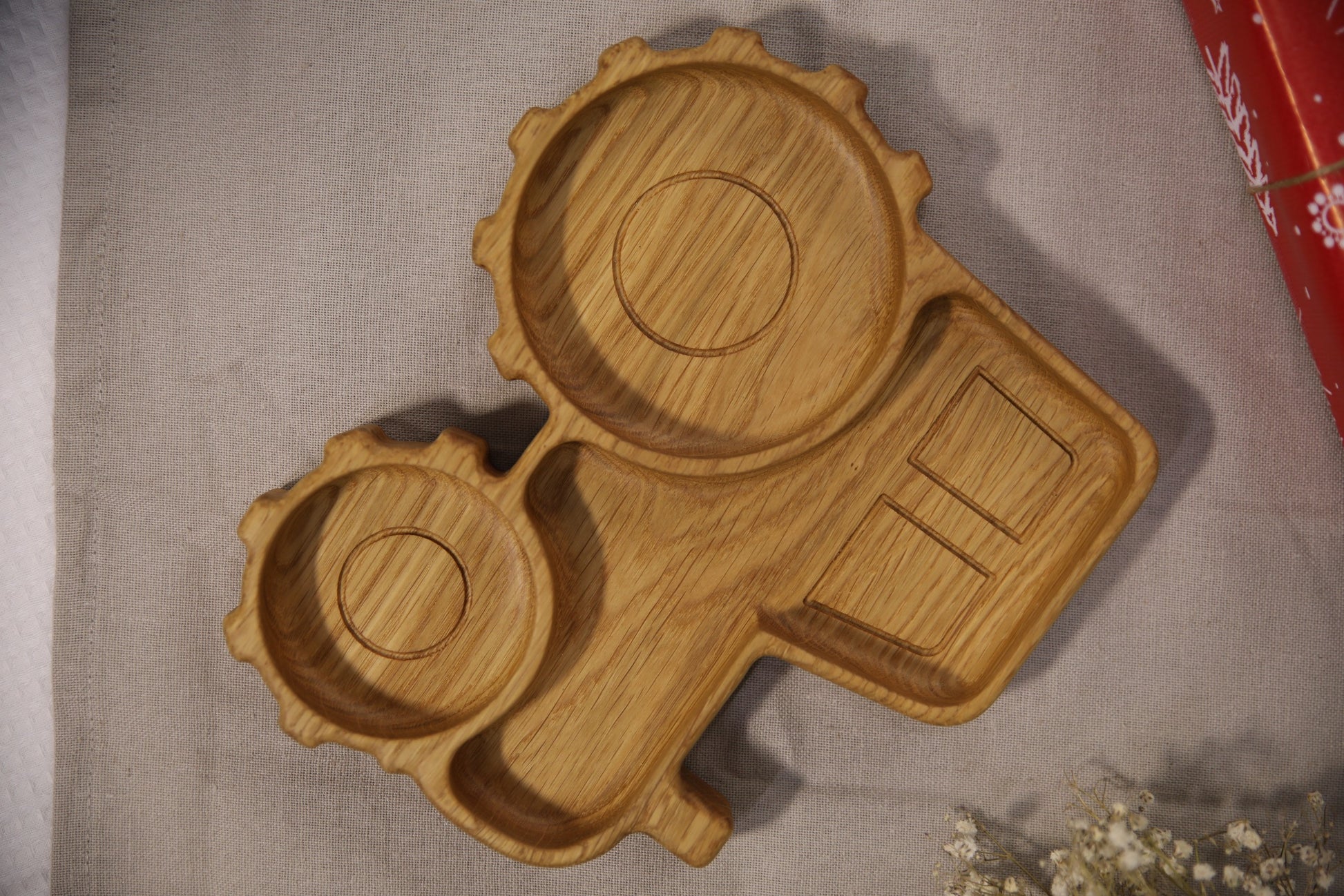 playful tractor wooden plate for kids on a sunlit table