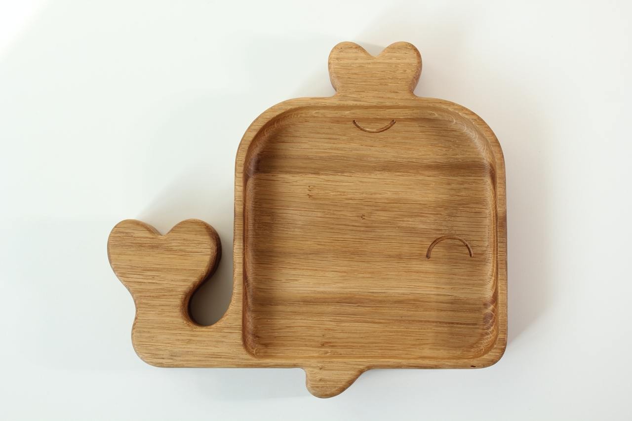 handmade wooden whale plate for kids on a rustic table, showcasing natural oak grain and smooth polished finish