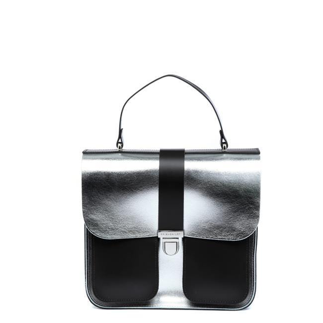 a bold silver leather top handle bag with a chocolate calf hair base, confidently styled for a contemporary woman